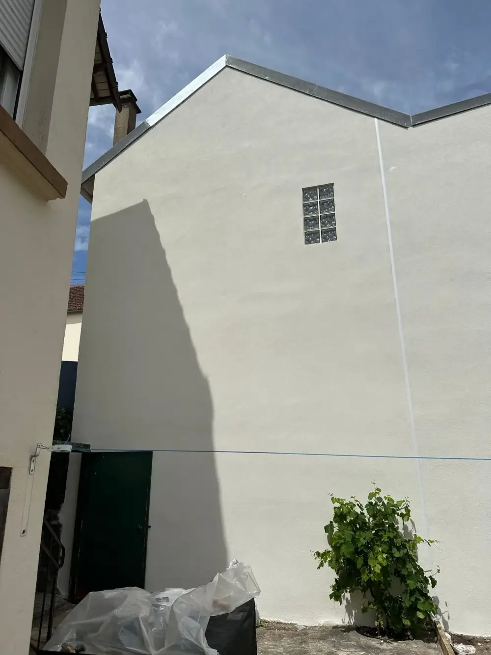 Ravalement d'un pignon d'une maison à Argenteuil